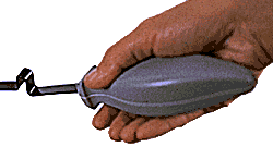 Hand grasping the handle of the utensil.
